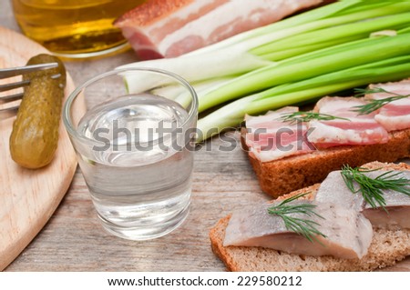 Vodka, green onion, cucumber and bacon sandwiches and herring