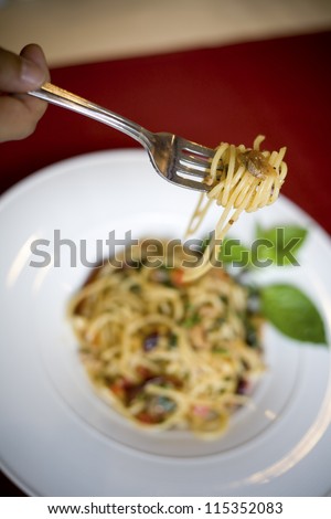 spaghetti with tomato sauce with fork