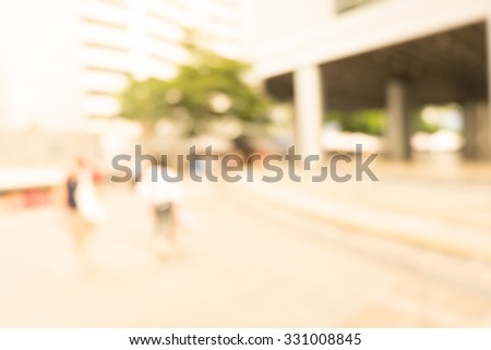 Blurred background : people shopping at market fair in sunny day, blur background