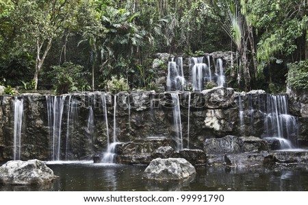 Water fall in spring season located in deep rain forest jungle