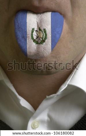 man with open mouth spreading tongue colored in guatemala flag as symbol of values like teaching, learning, multilingual speaking of different languages
