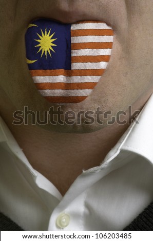 man wit open mouth spreading tongue colored in malaysia flag as symbol of values like teaching, learning, multilingual speaking of different languages