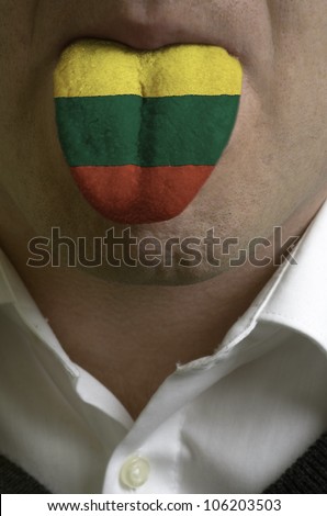 man with open mouth spreading tongue colored in lithuania flag as symbol of values like teaching, learning, multilingual speaking of different languages