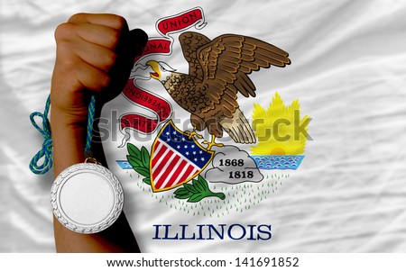 Holding silver medal for sport and flag of us state of illinois