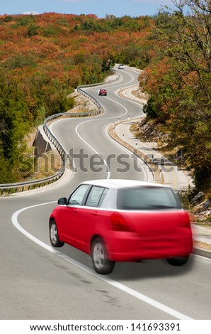 traveling car in national flag of poland colors and beautiful road landscape for tourism and touristic adertising