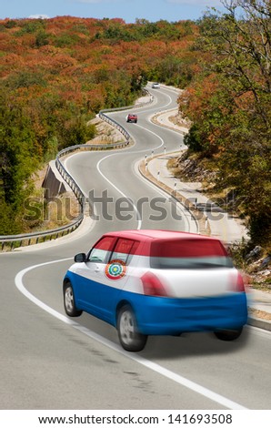 traveling car in national flag of paraguay colors and beautiful road landscape for tourism and touristic adertising