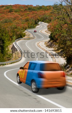 traveling car in national flag of mongolia colors and beautiful road landscape for tourism and touristic adertising