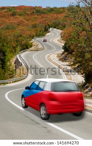 traveling car in national flag of czech colors and beautiful road landscape for tourism and touristic adertising