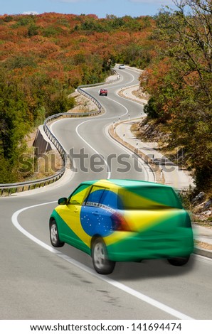 traveling car in national flag of brazil colors and beautiful road landscape for tourism and touristic adertising