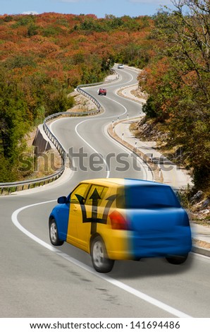 traveling car in national flag of barbados colors and beautiful road landscape for tourism and touristic adertising