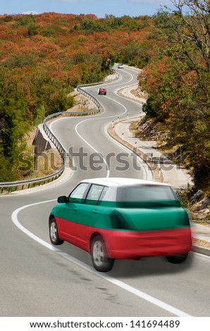 traveling car in national flag of bulgaria colors and beautiful road landscape for tourism and touristic adertising