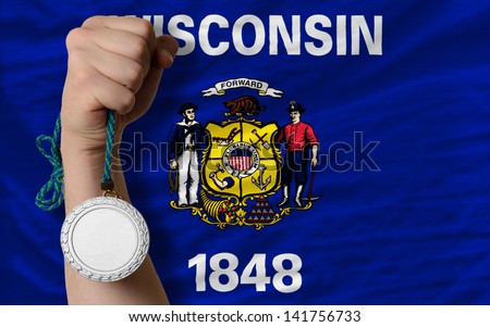 Holding silver medal for sport and flag of us state of wisconsin