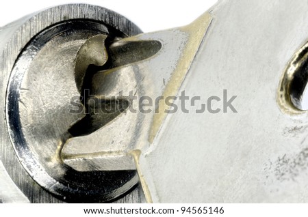 true macro shot, focus stacked, of key in keyhole - symbolizing safety and security