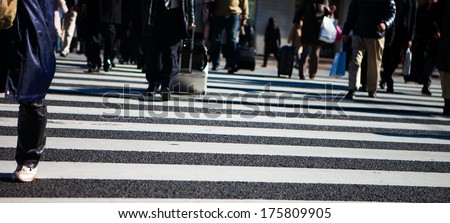 group of people crossing on zebra cross