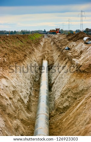 Work in progress burying gas pipe in a country area