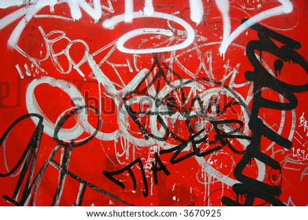 stock photo : Black and white graffiti on red background
