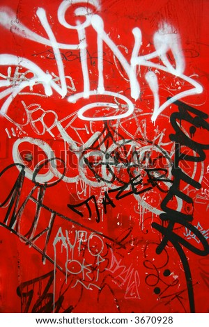 Black and white graffiti on red background