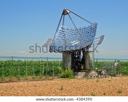 Photovoltaic Solar Cells on Water Heating Mirror Solar Panels And Photovoltaic Cells Stock Photo