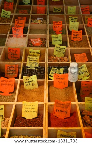 Spices on display with hand written price tag