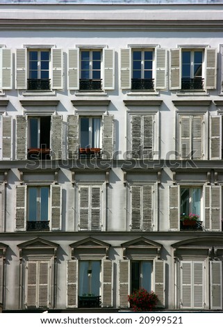 White neoclassical facade of a Paris downtown building