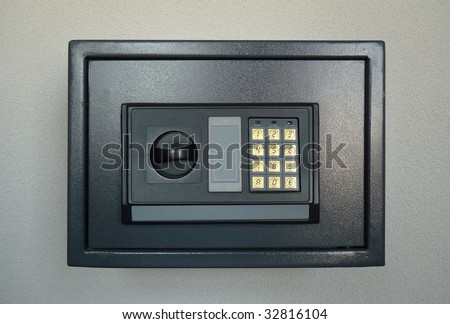 Small home or hotel wall safe with keypad, closed door