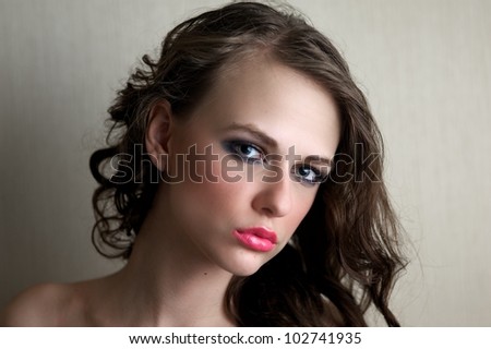 Attractive female gazing into the camera, sweet, innocent expression