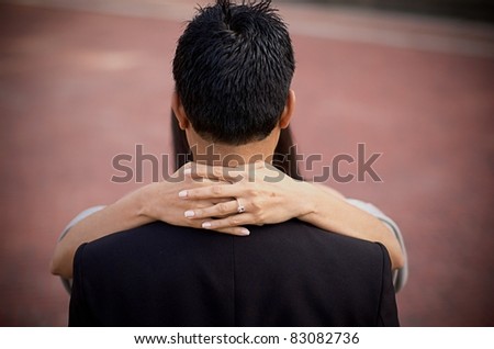 Young Indian couple embracing with the appearance as one person