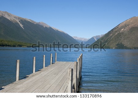 Jetty on Lake Rotoiti in the Nelson Lakes District with mountains, South Island, New Zealand.