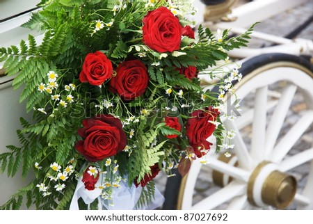 stock photo Flowered wedding carriage with huge bouquet on side