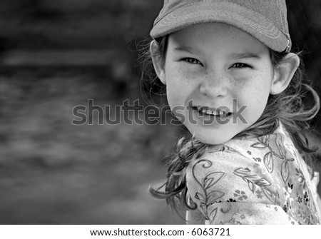 Young Girl Wearing Ball Cap