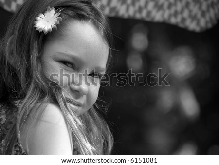Young Girl Looking Over Shoulder at Cafe Table
