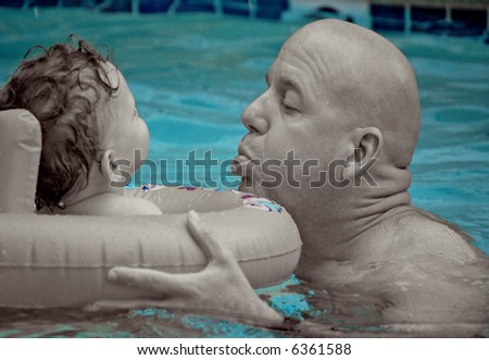 Father and Son in Swimming Pool