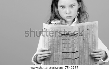 Young Girl in Shock and Awe Over Financial Page in Newspaper