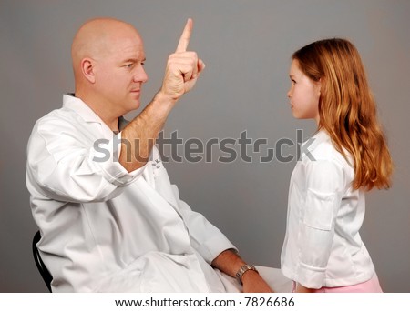 Physician Giving Physical Exam to Young Girl