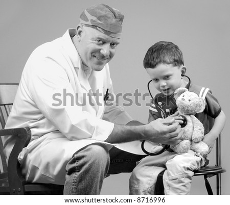 Physician Examining Child and His Bear