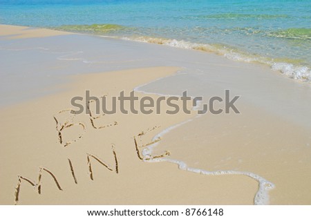 Be Mine Written in Sand on Beach Near Pretty Ocean Surf