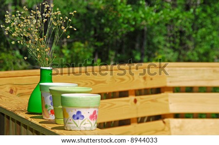 Deck by Woods with Pretty Pots and Vase