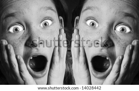 Funny scared expression of freckle faced girl missing front teeth