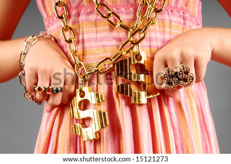 stock-photo-young-girl-wearing-gaudy-hip-hop-jewelry-15121273.jpg