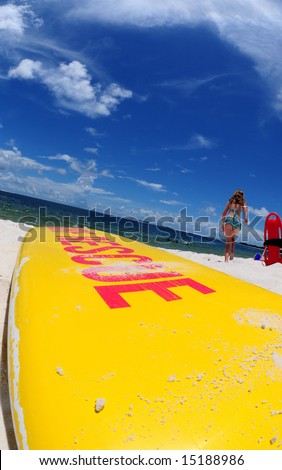 Lifeguard rescue surfboard on pretty beach