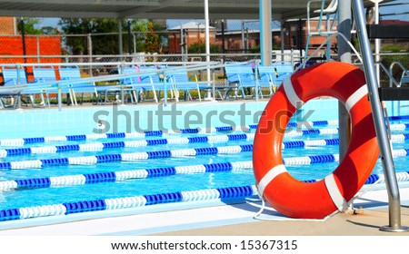 Life preserver by lanes in public swimming pool