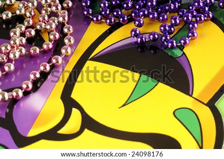 Traditional mardi gras tragedy mask and beads