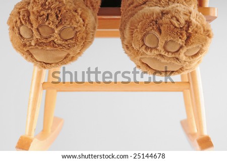 bear feet in wooden rocking chair