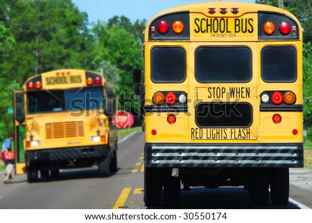 school bus on rural road picking up children