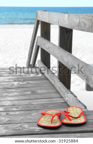 flip flops on the beach. Pretty straw flip flops on