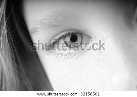 young girl\'s eye with serious expression