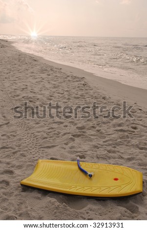 Boogie board left behind at beach at end of the day
