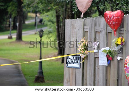 BEULAH, FL - JULY 14: A memorial outside the Billings family home is shown on July 14, 2009 in Beulah, Florida. Police are investigating the murders of the couple during a recent home invasion.