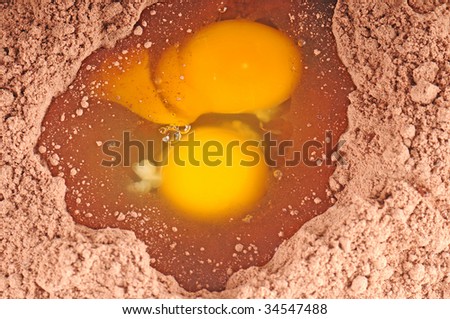 Eggs broken in batter of chocolate cake mix