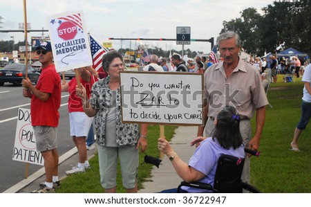 PENSACOLA, FLORIDA - SEPTEMBER 7: Concerned citizens protest Healthcare Reform while standing along Davis Highway on September 7, 2009 in Pensacola, Florida.